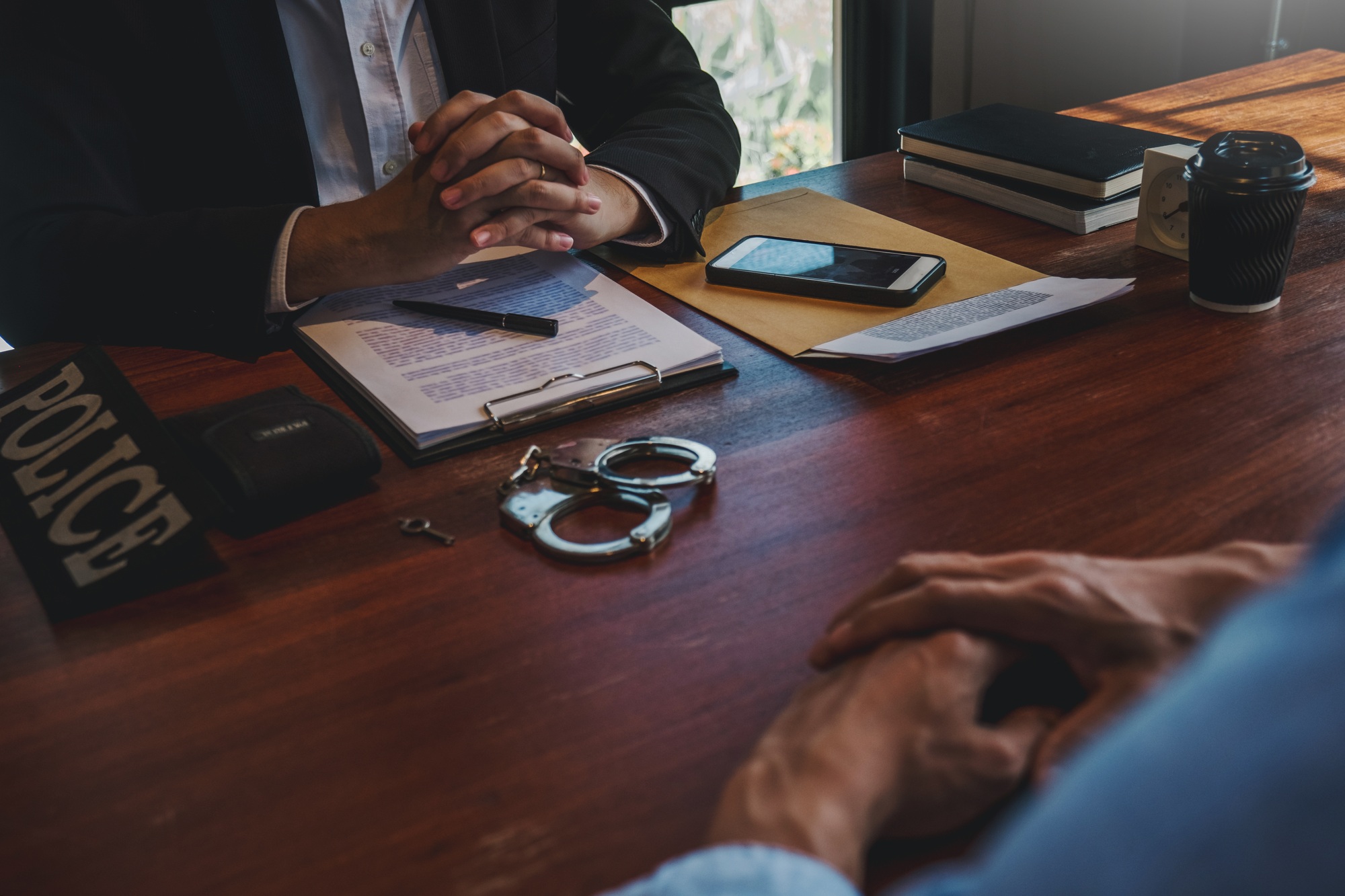 Law enforcement officer interrogating Criminals male